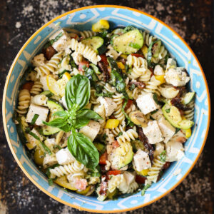 mediterranean pasta salad in a blue bowl