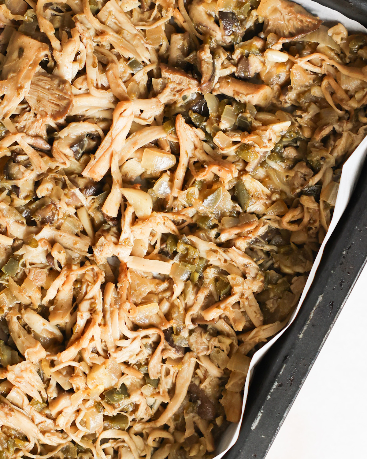 close up of vegan carnitas on a baking sheet