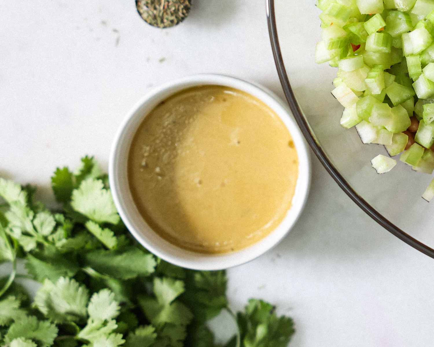 Bean salad dressing in a bowl.