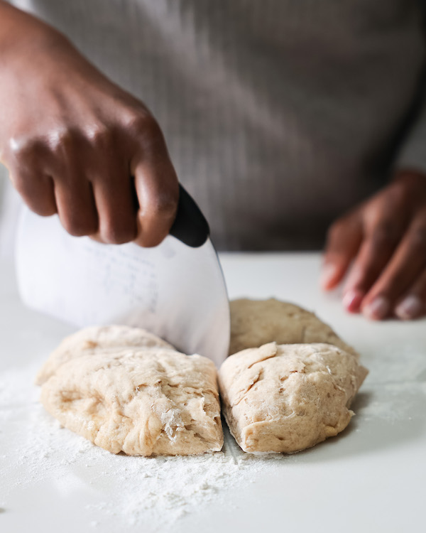 Cutting dough with dough scraper