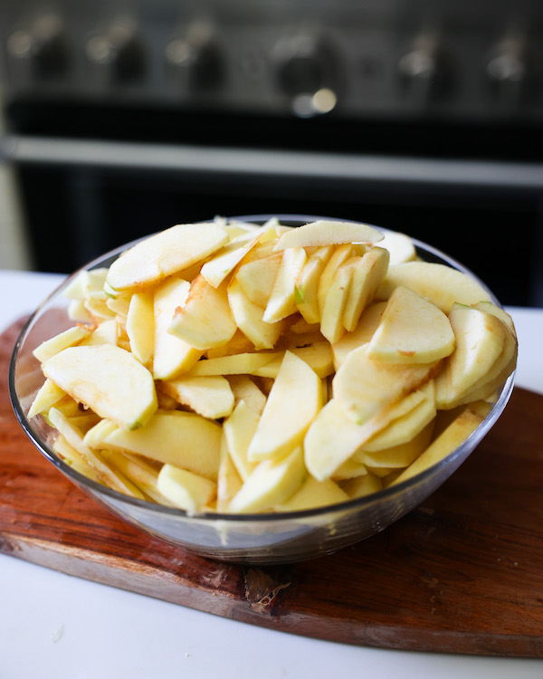 Sliced apples in a mixing bowl