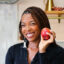 Jenne Claiborne in kitchen with apples