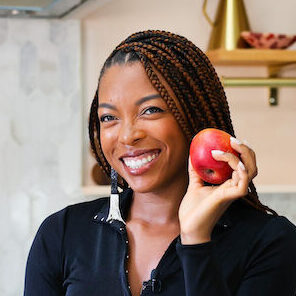 Jenne Claiborne in kitchen with apples