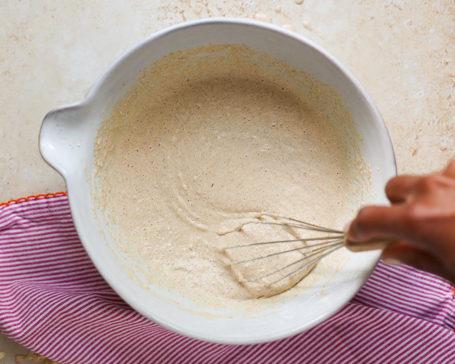 Mixing batter in a mixing bowl.