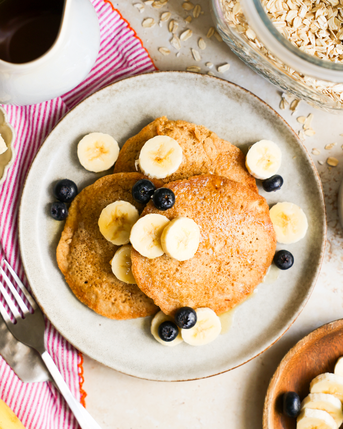 Oat flour pancakes on a plate.