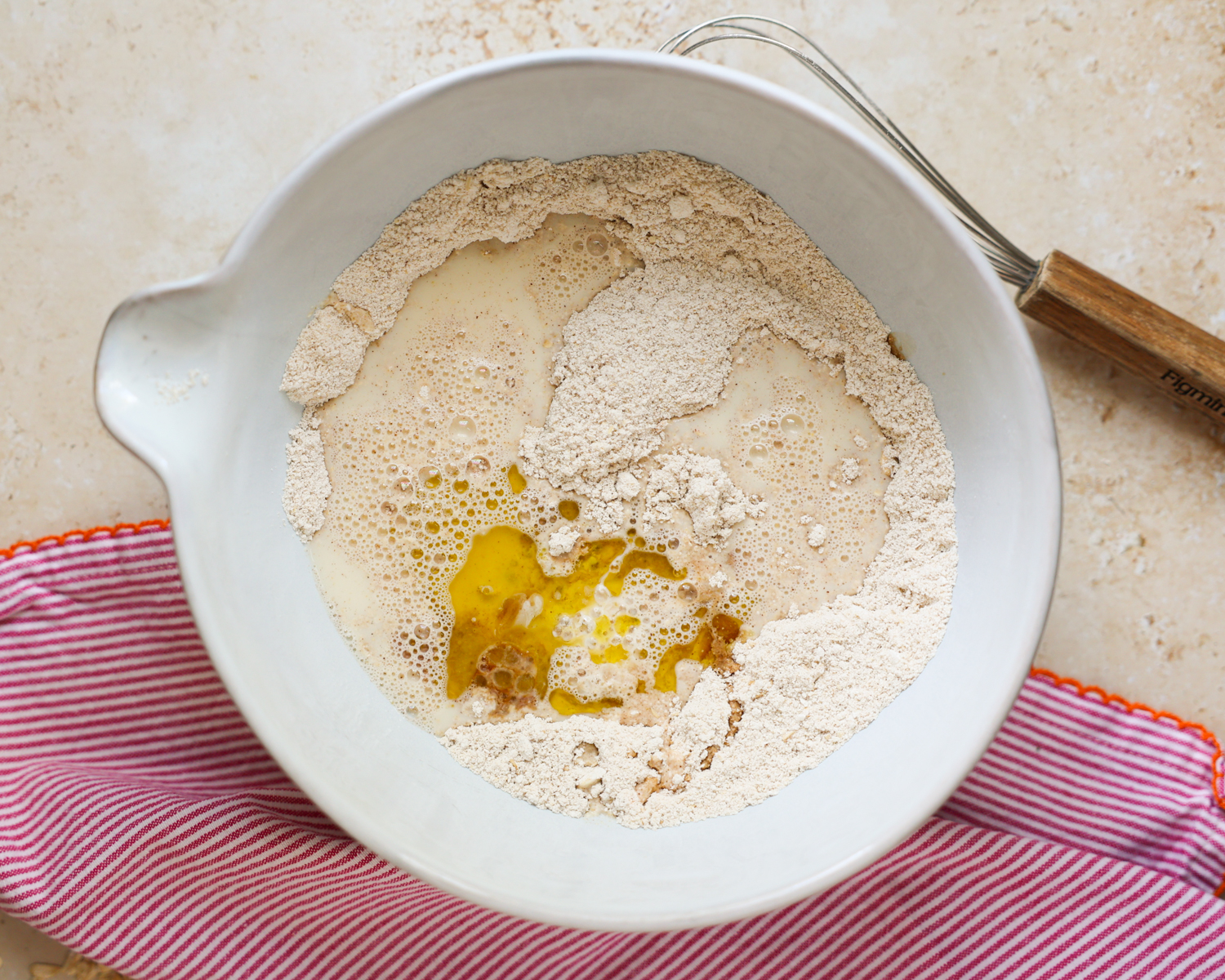 Wet pancake ingredients added to the mixing bowl.