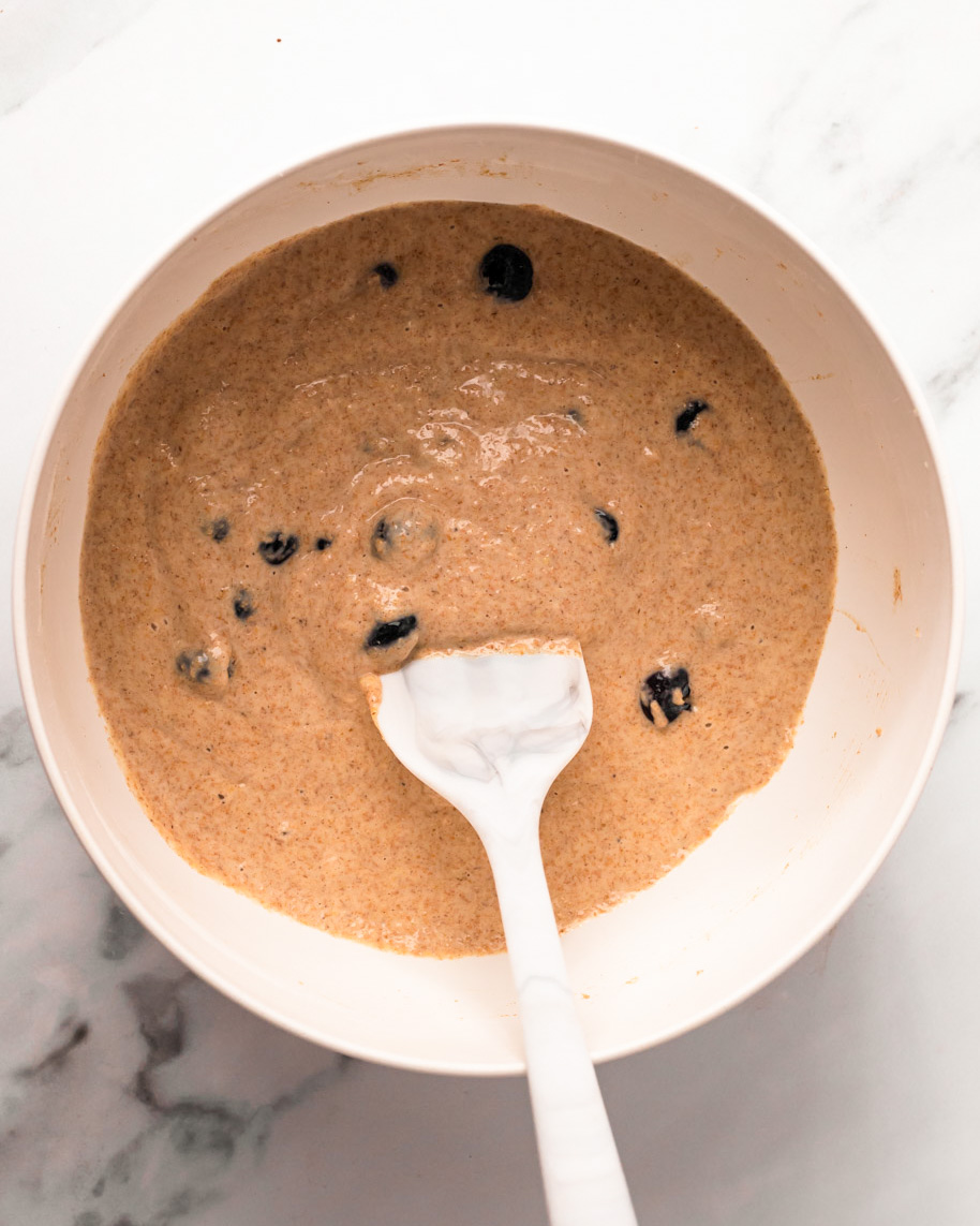 A mixing bowl of the vegan blueberry pancake batter.