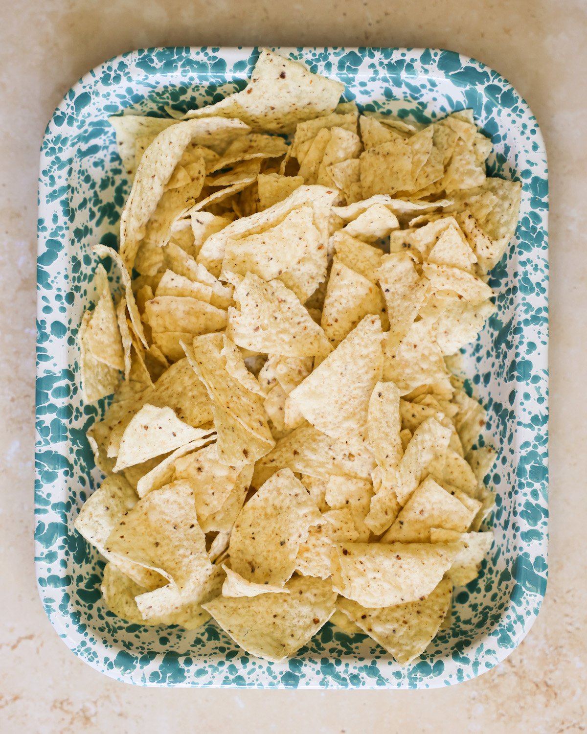 An overhead shot of a tray of tortilla chips.