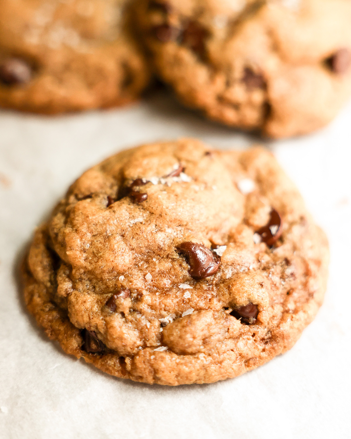 vegan chocolate chip cookies on parchment paper