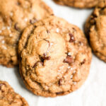 vegan chocolate chip cookie stack on white parchment paper
