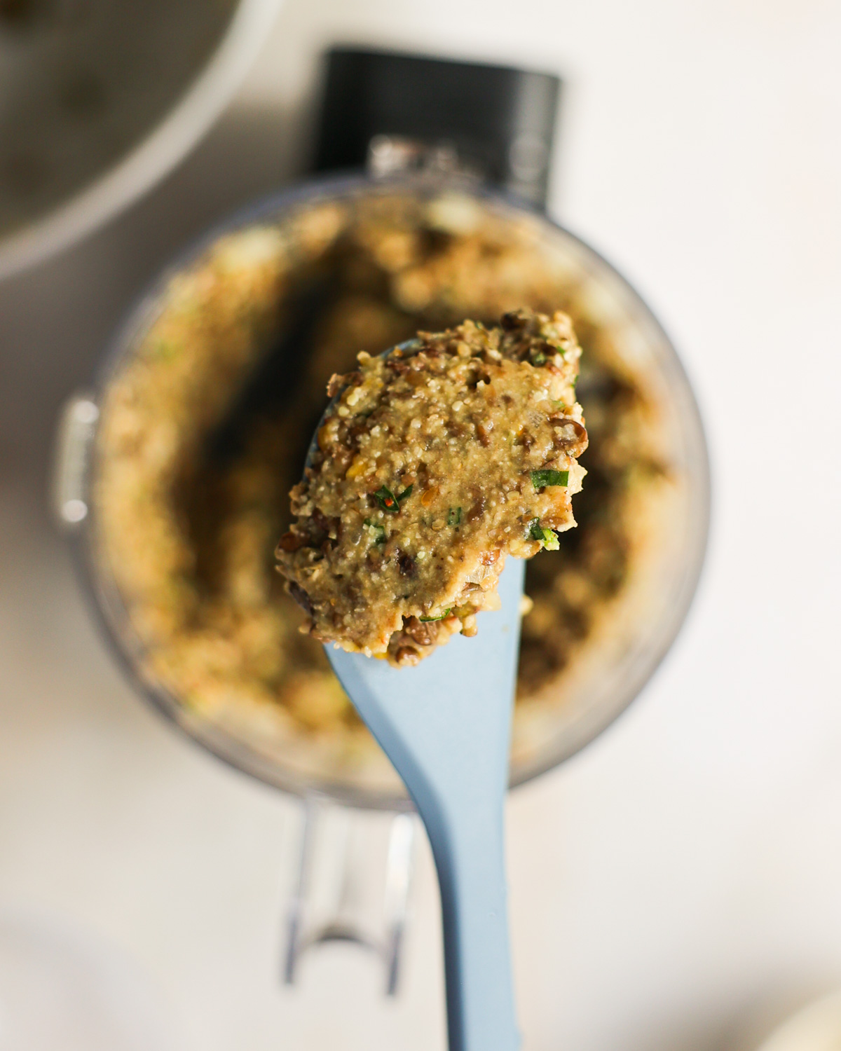 closeup of blended batter on a blue spatula