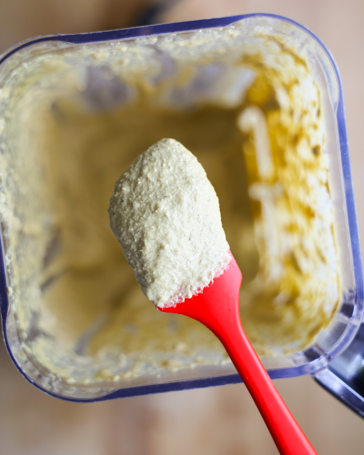 creamy vegan caesar dressing ingredients on a spatula