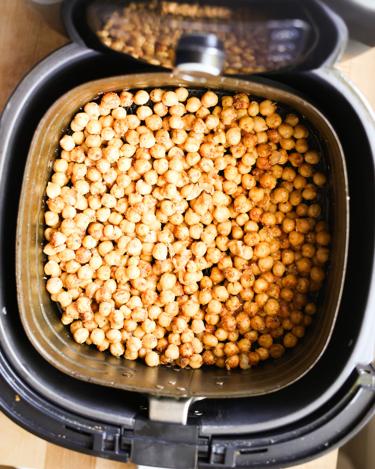 An overhead shot of the roasted chickpeas in the air fryer.