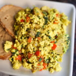 tofu scramble with toast on white plate