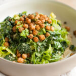 Vegan caesar salad in a white bowl.