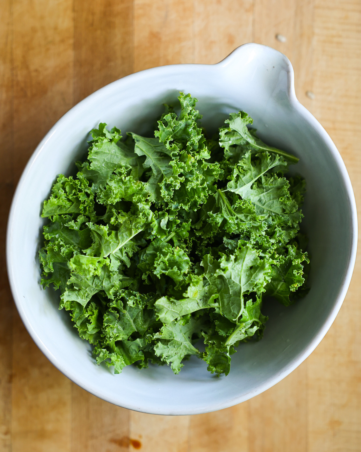 kale in a white salad bowl