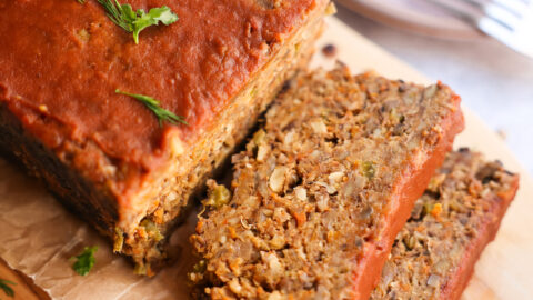 vegan meatloaf sliced on wooden tray