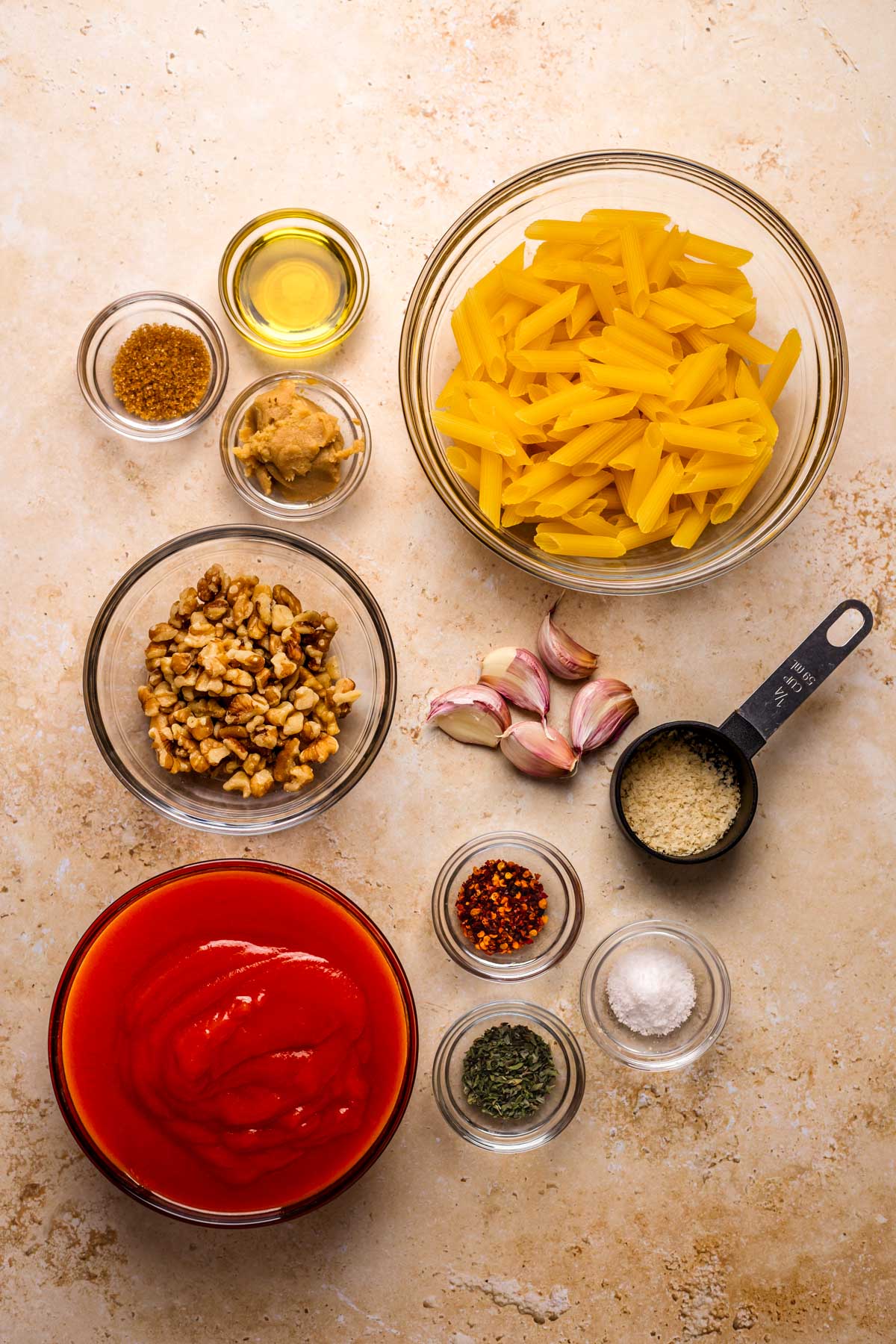 All of the ingredients to make arrabbiata sauce with penne.
