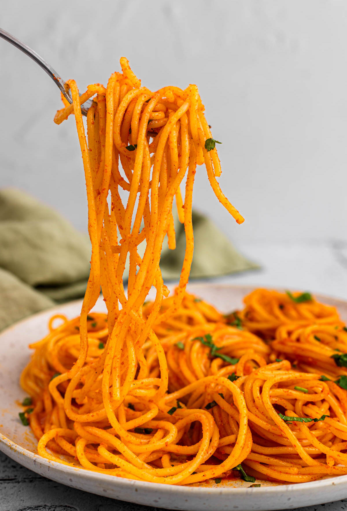 forkful of Gochujang Buttered Noodles over plate