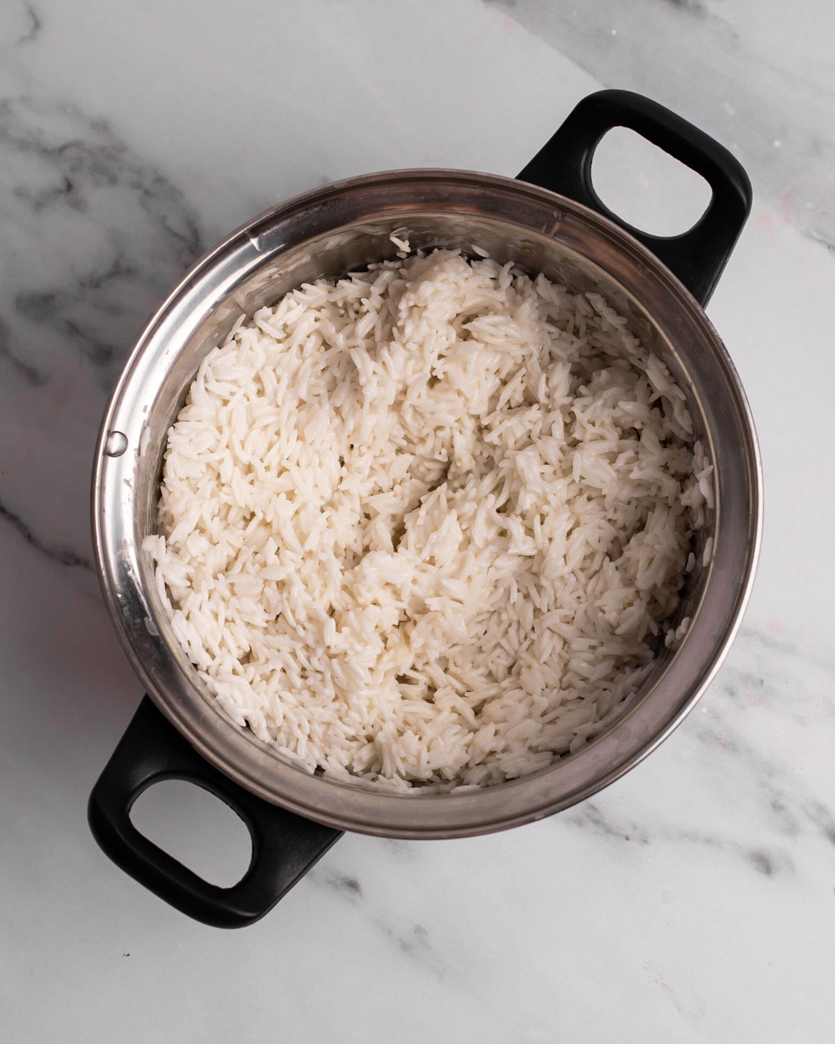 overhead of cooked coconut jasmine rice in a pot