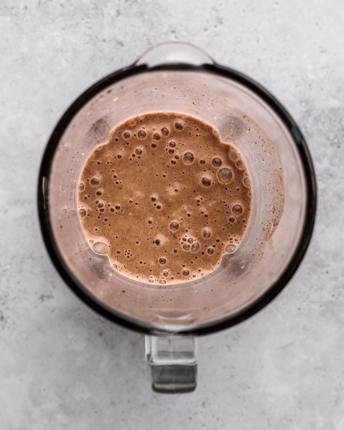 overhead of creamy blended vegan milkshake