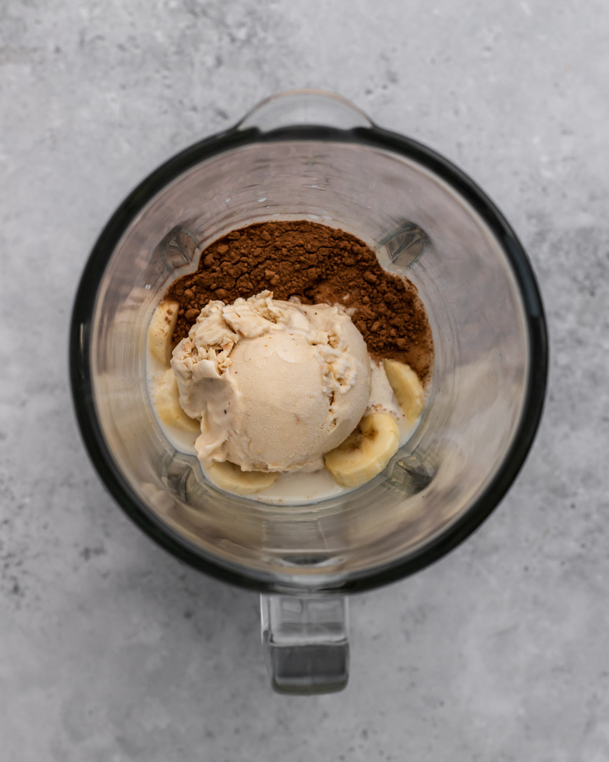 overhead of vegan milkshake ingredients in a blender