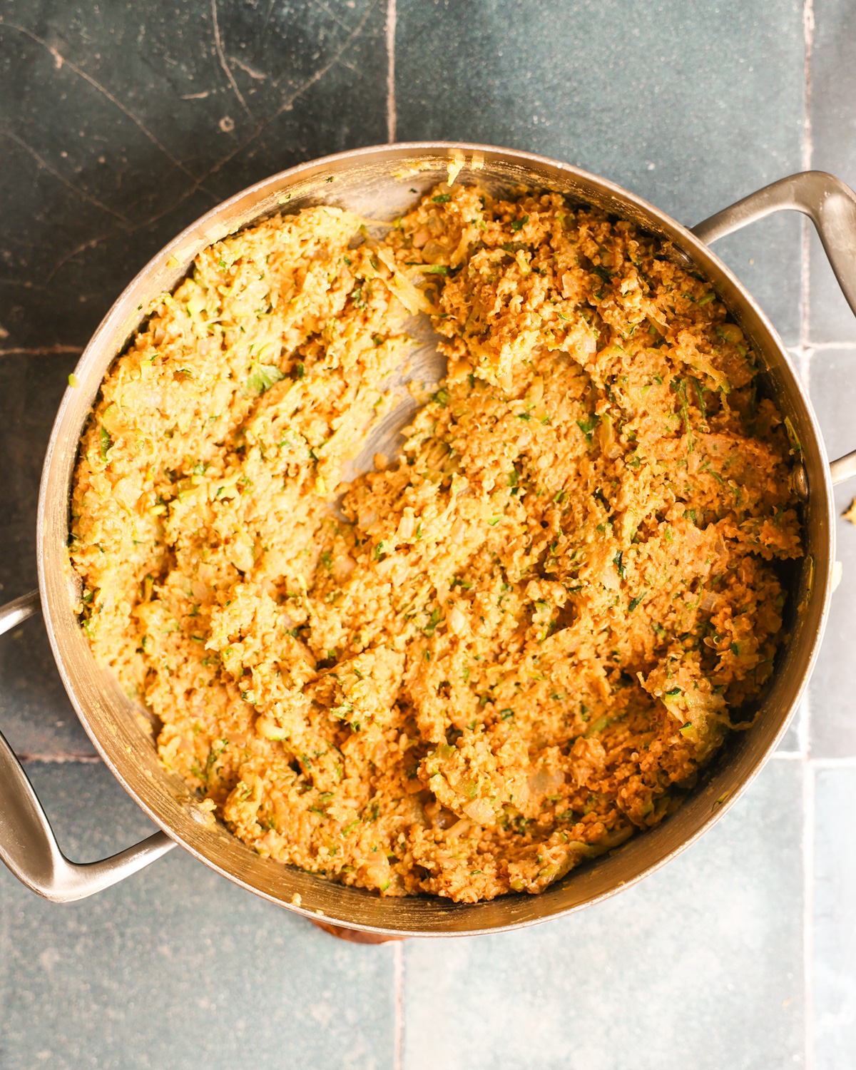 overhead of zucchini burger batter chilling in pan