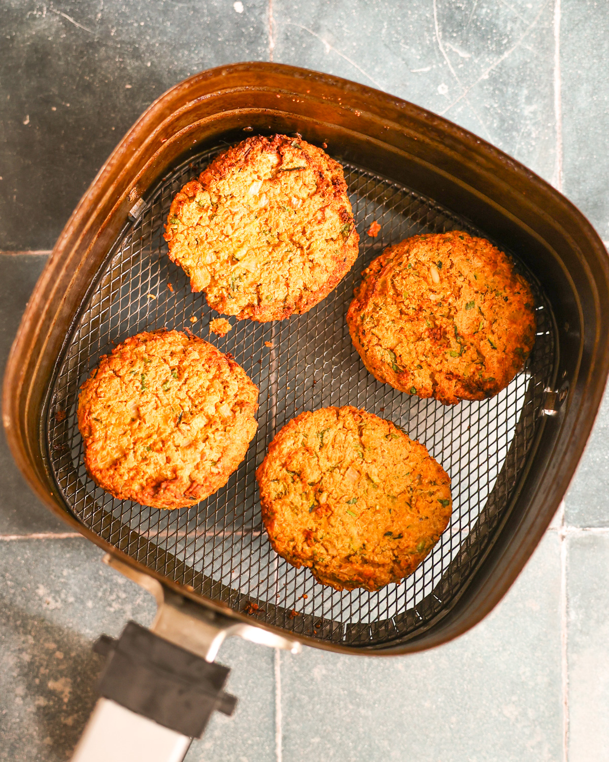 overhead of zucchini burgers cooked in air fryer