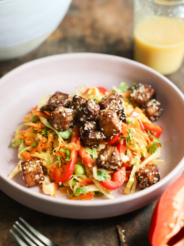 An angled overhead shot of a bowl of Crunchy Sesame Tofu Salad.