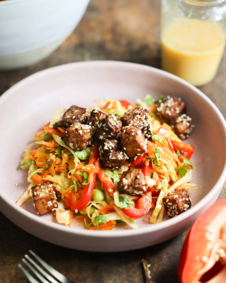 An angled overhead shot of a bowl of Crunchy Sesame Tofu Salad.