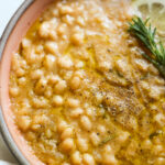 Creamy instant pot white beans in a bowl.