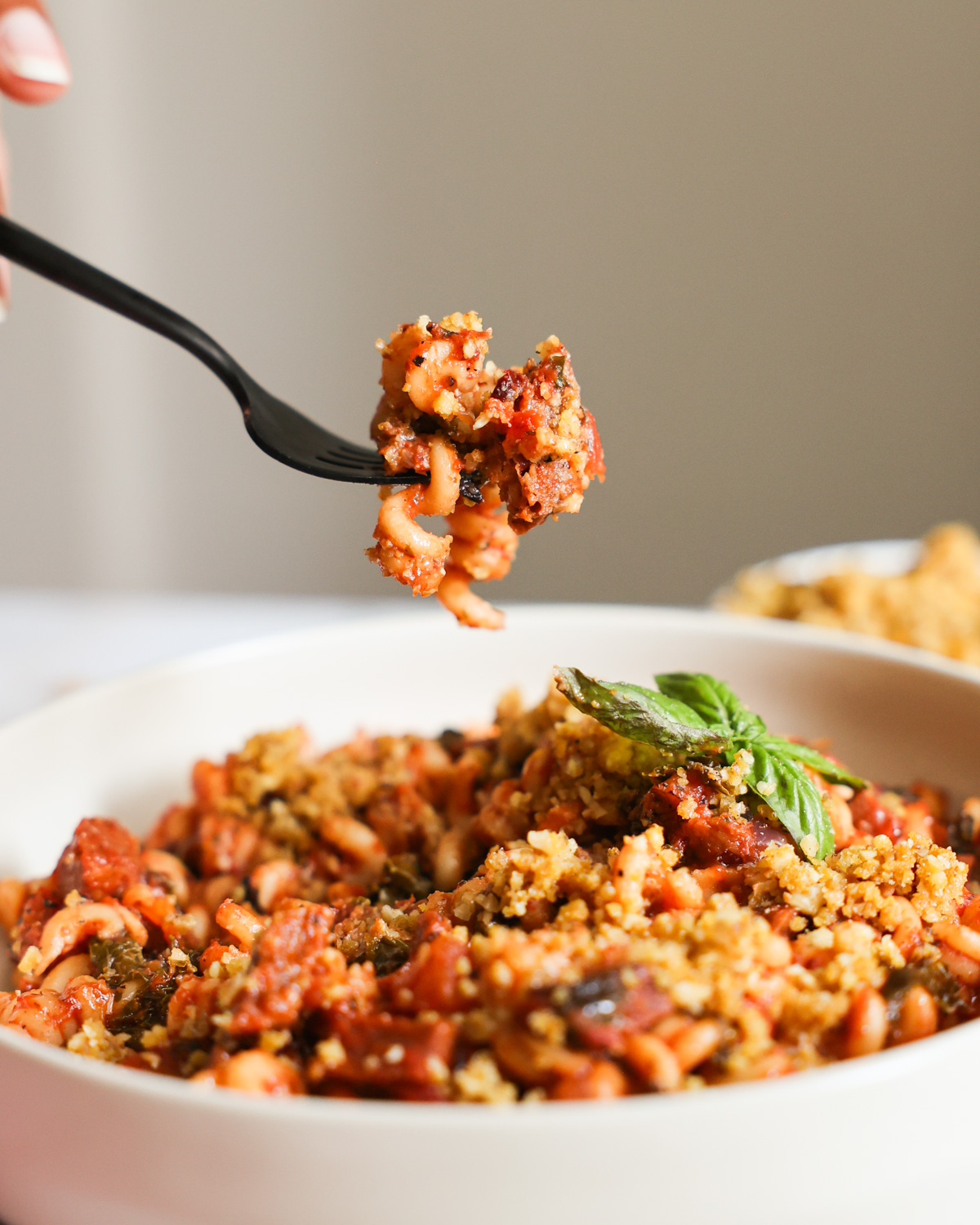 An up-close side shot of a bite of Instant Pot Vegan Sausage Pasta.