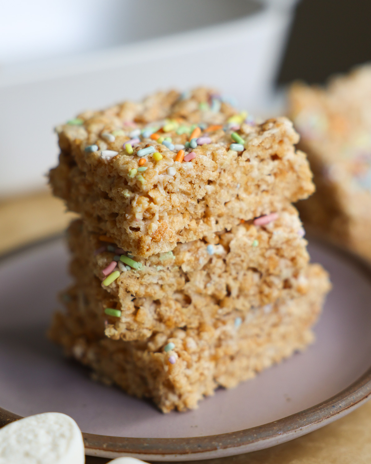 vegan rice crispy treats stacked on a plate