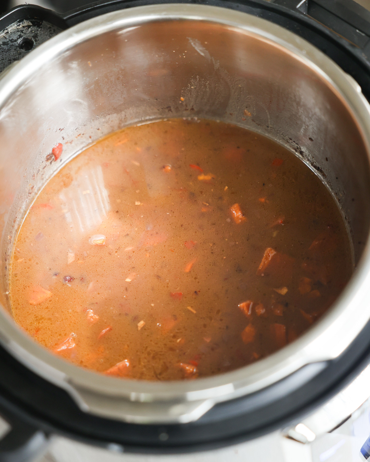 overhead of cooked black beans soup in instant pot