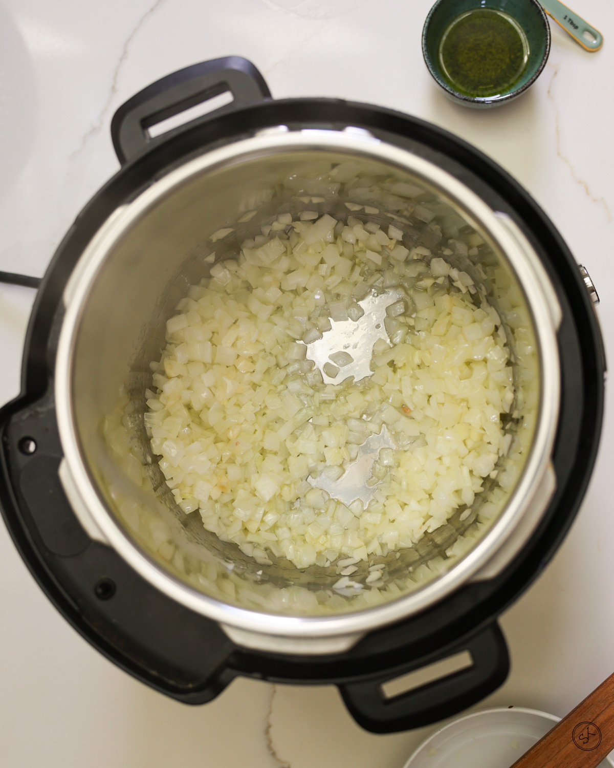 Onions saut&eacute;ing in an instant pot. 