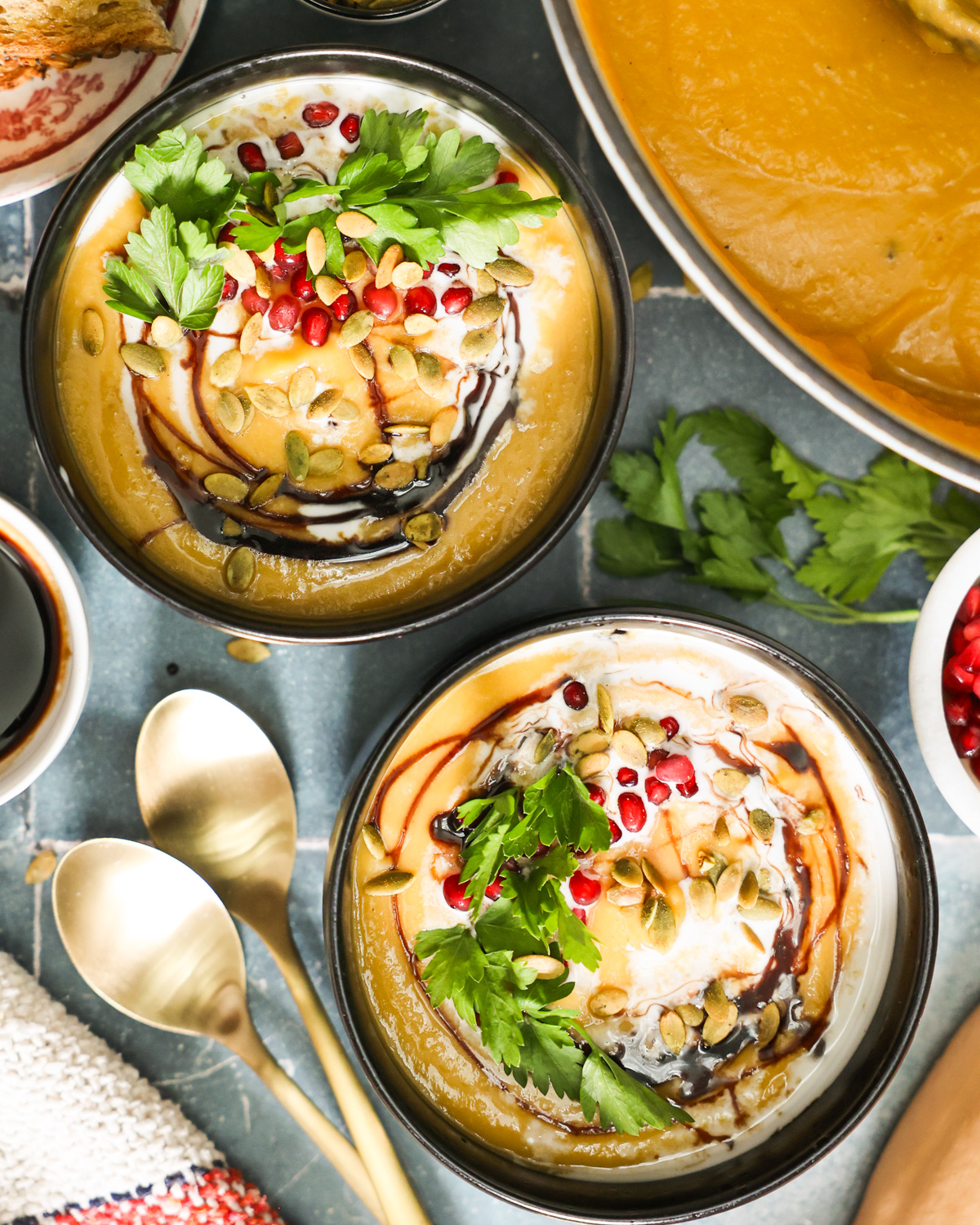 overhead of bowls of coconut butternut squash soup