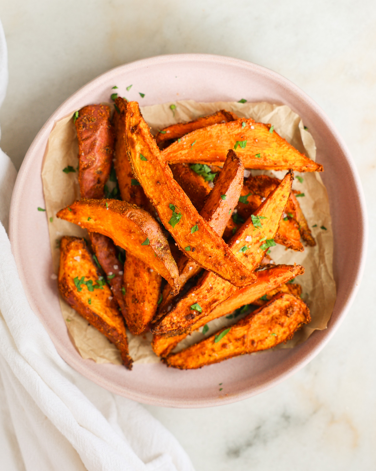 overhead of sweet potato wedges on a plate