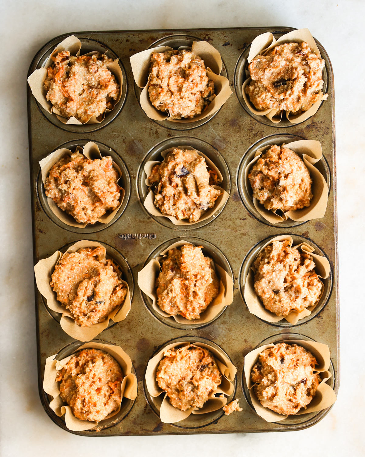 Oat bran muffins with sweet potato muffins before baking.