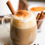 side view of sweet potato latte topped with cinnamon