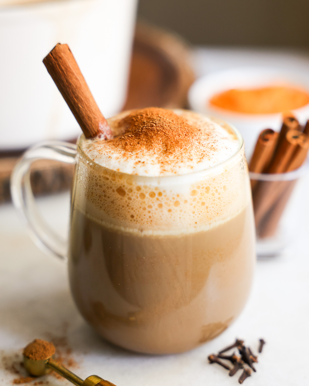 side view of sweet potato latte topped with cinnamon