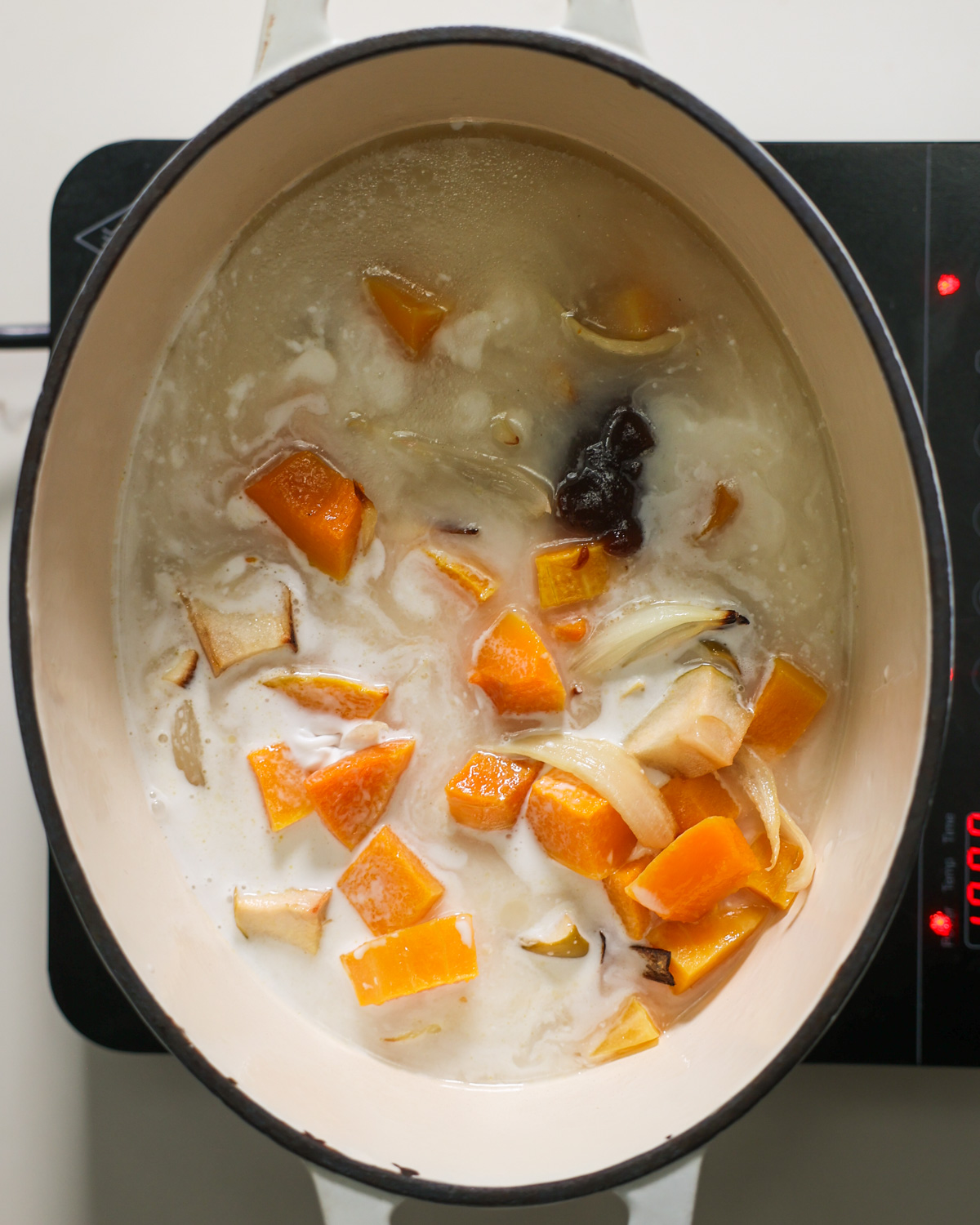 roasted butternut squash in pot with other ingredients