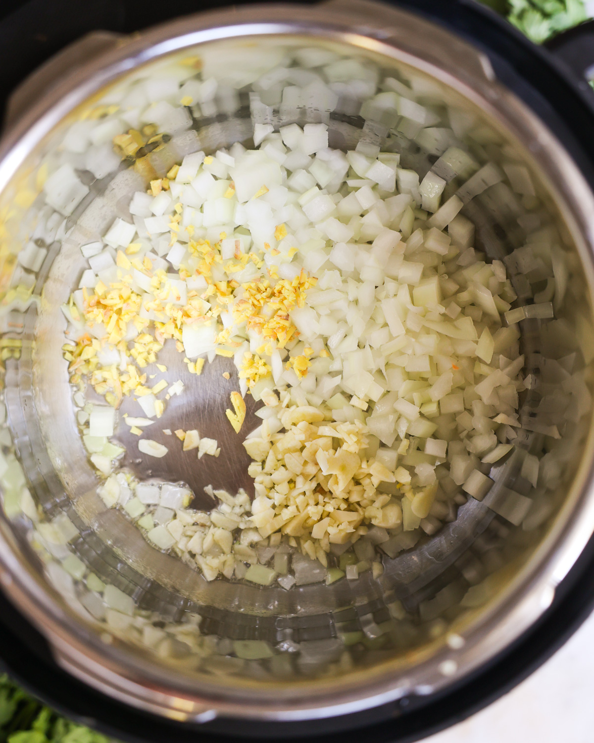 overhead of sautéing aromatics in instant pot