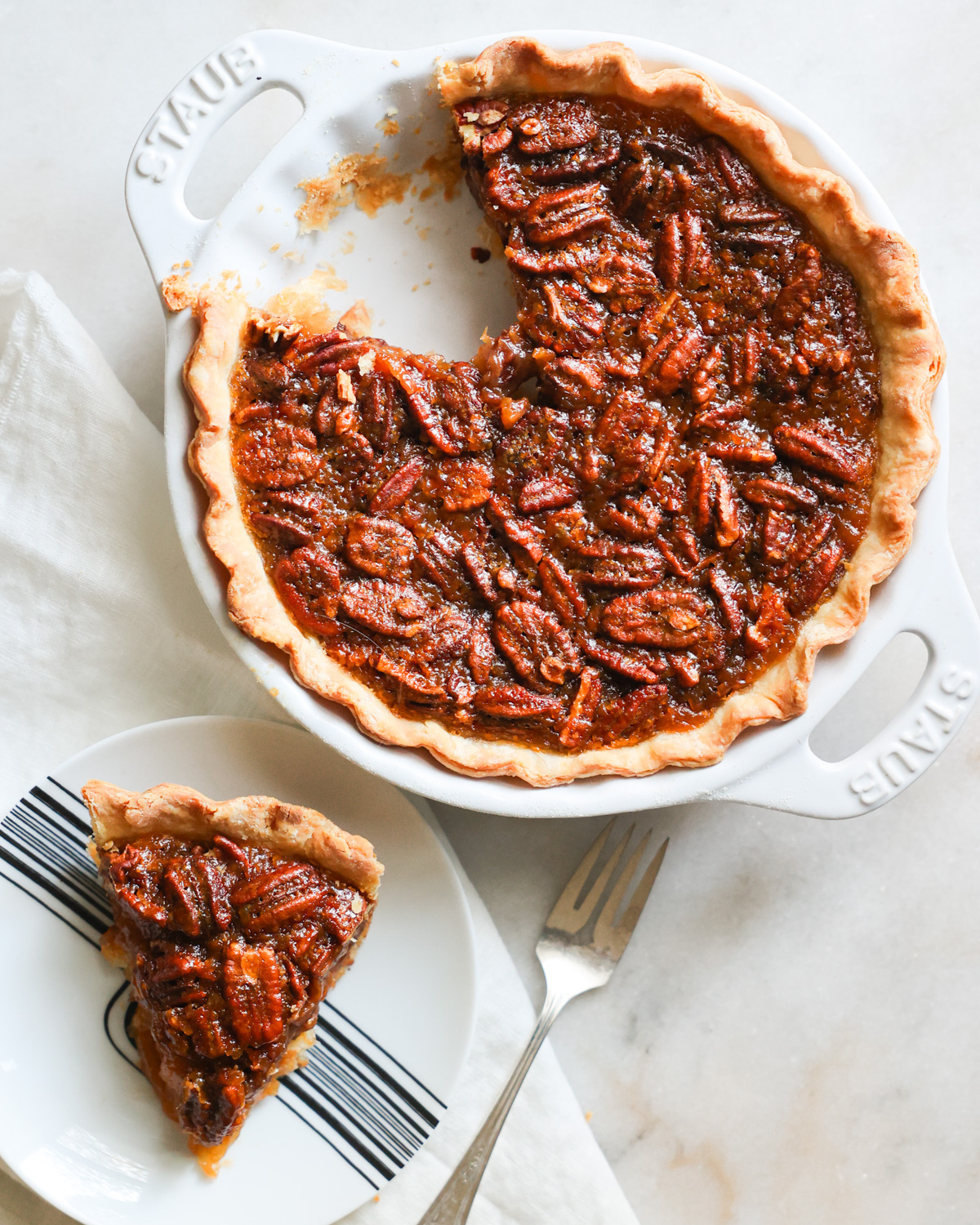 overhead vegan pecan pie with slice out