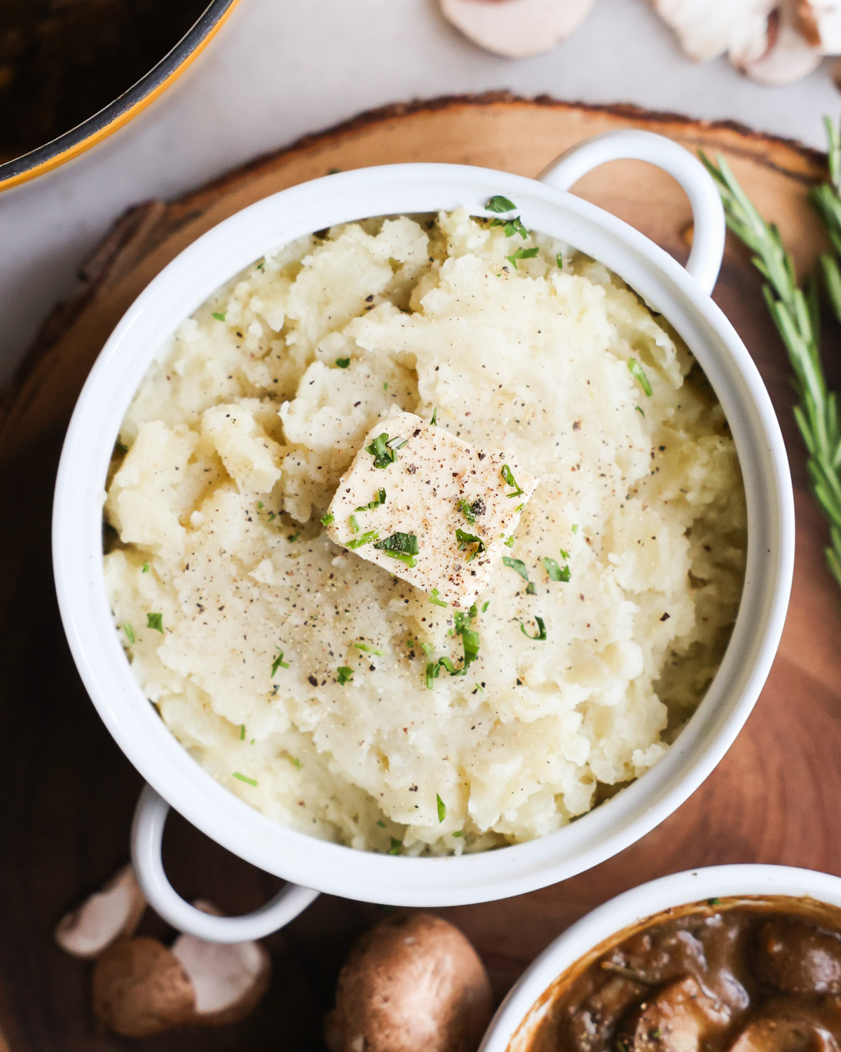 overhead of vegan mashed potatoes with mushroom gravy