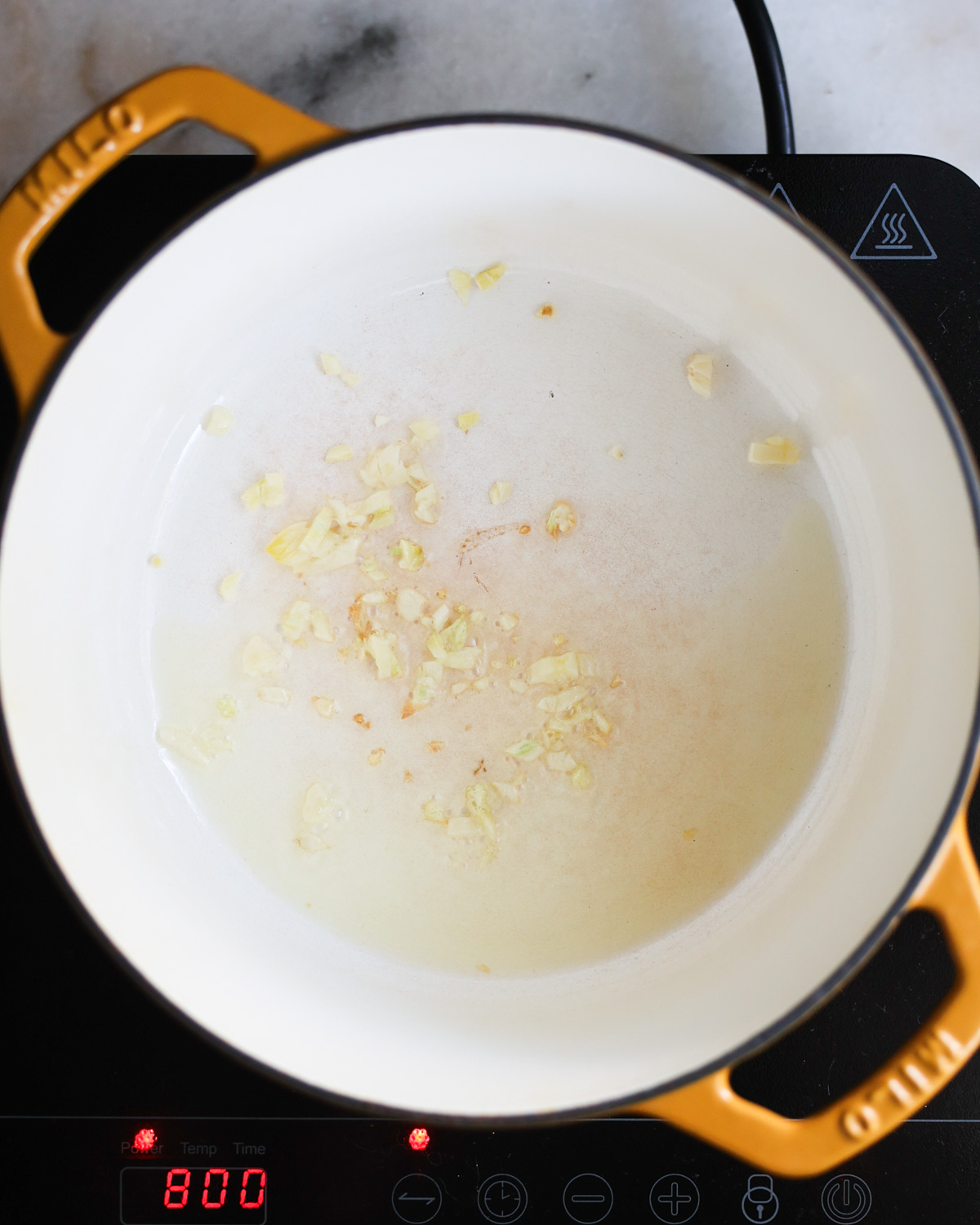 garlic sautéing in pot