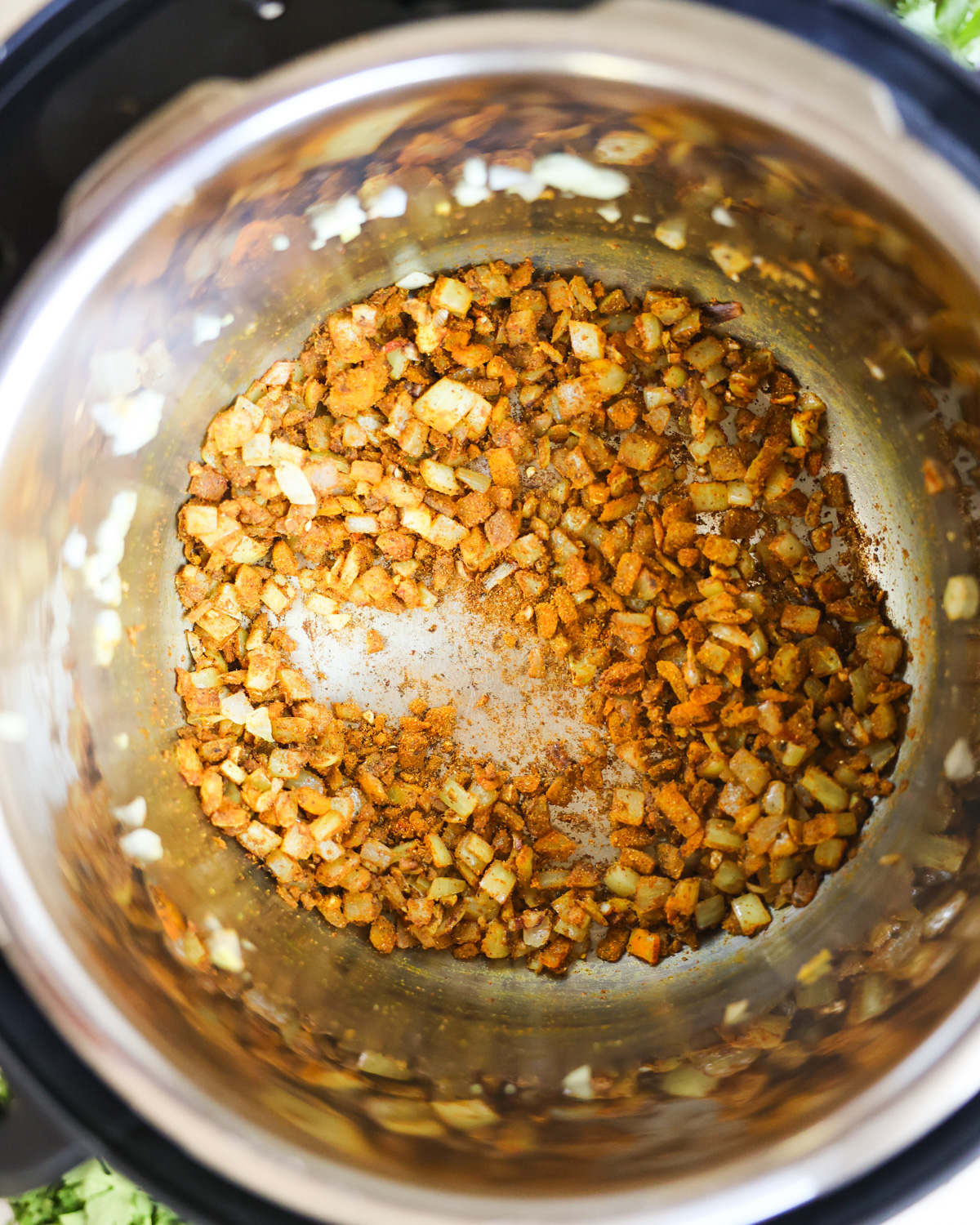 overhead of spices toasting in instant pot