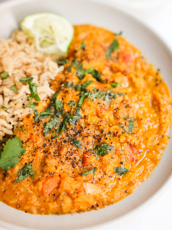 vegan red lentil curry in a white bowl