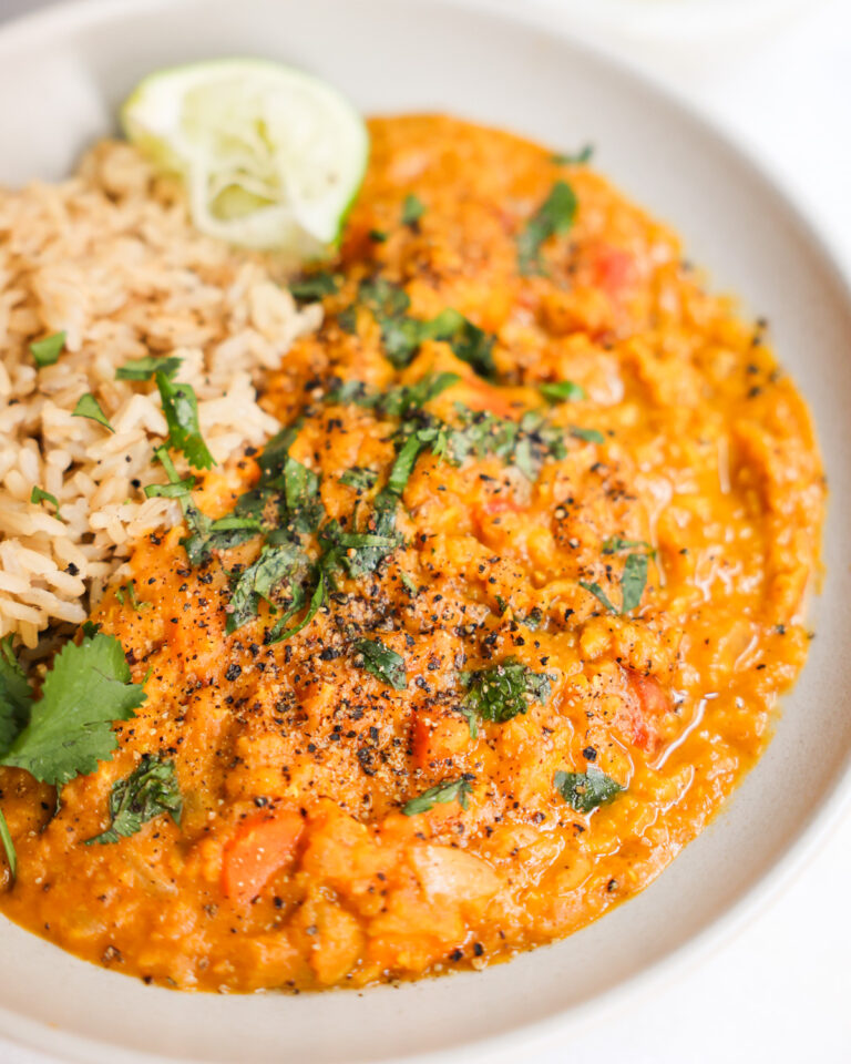 vegan red lentil curry in a white bowl