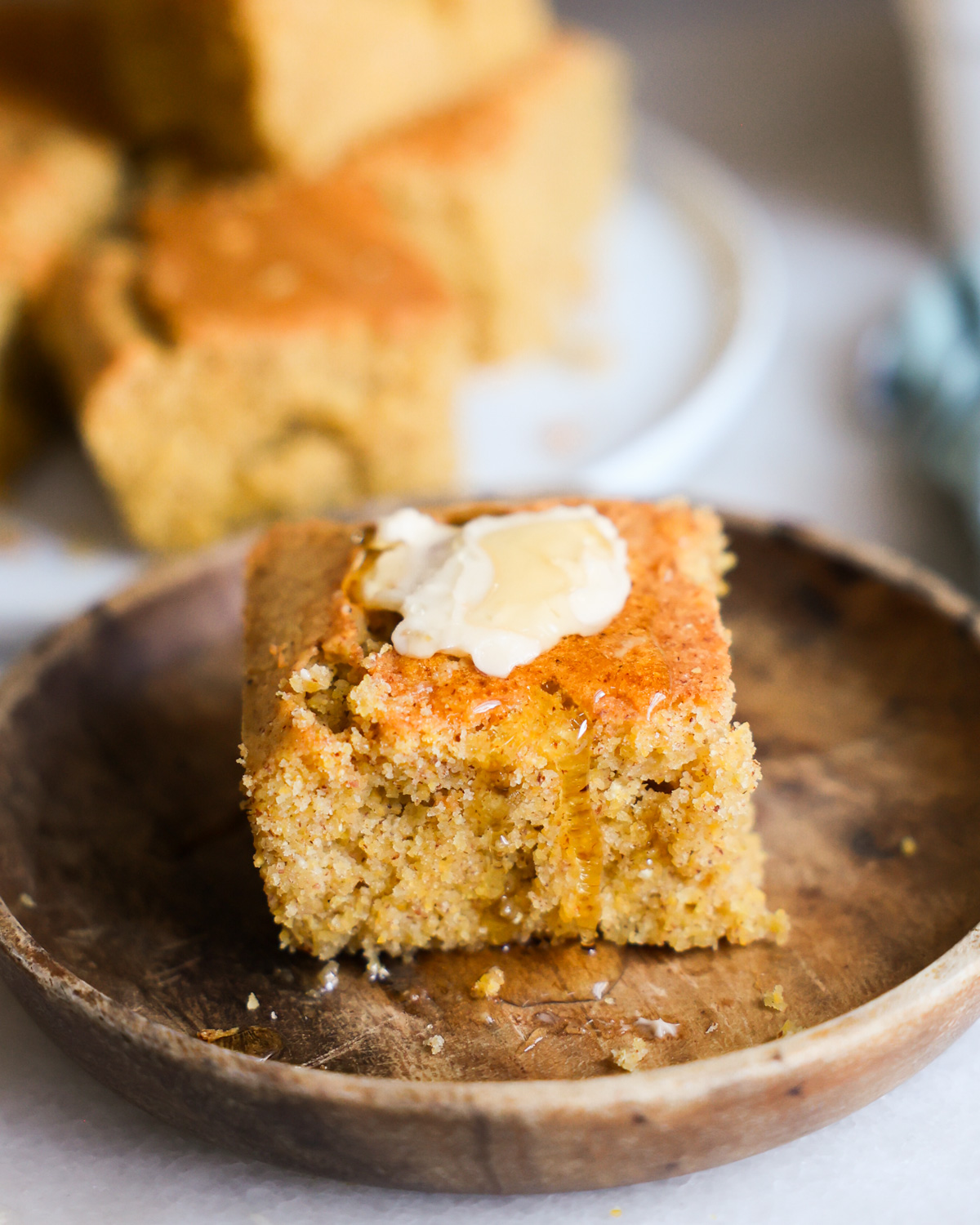 vegan cornbread topped with butter