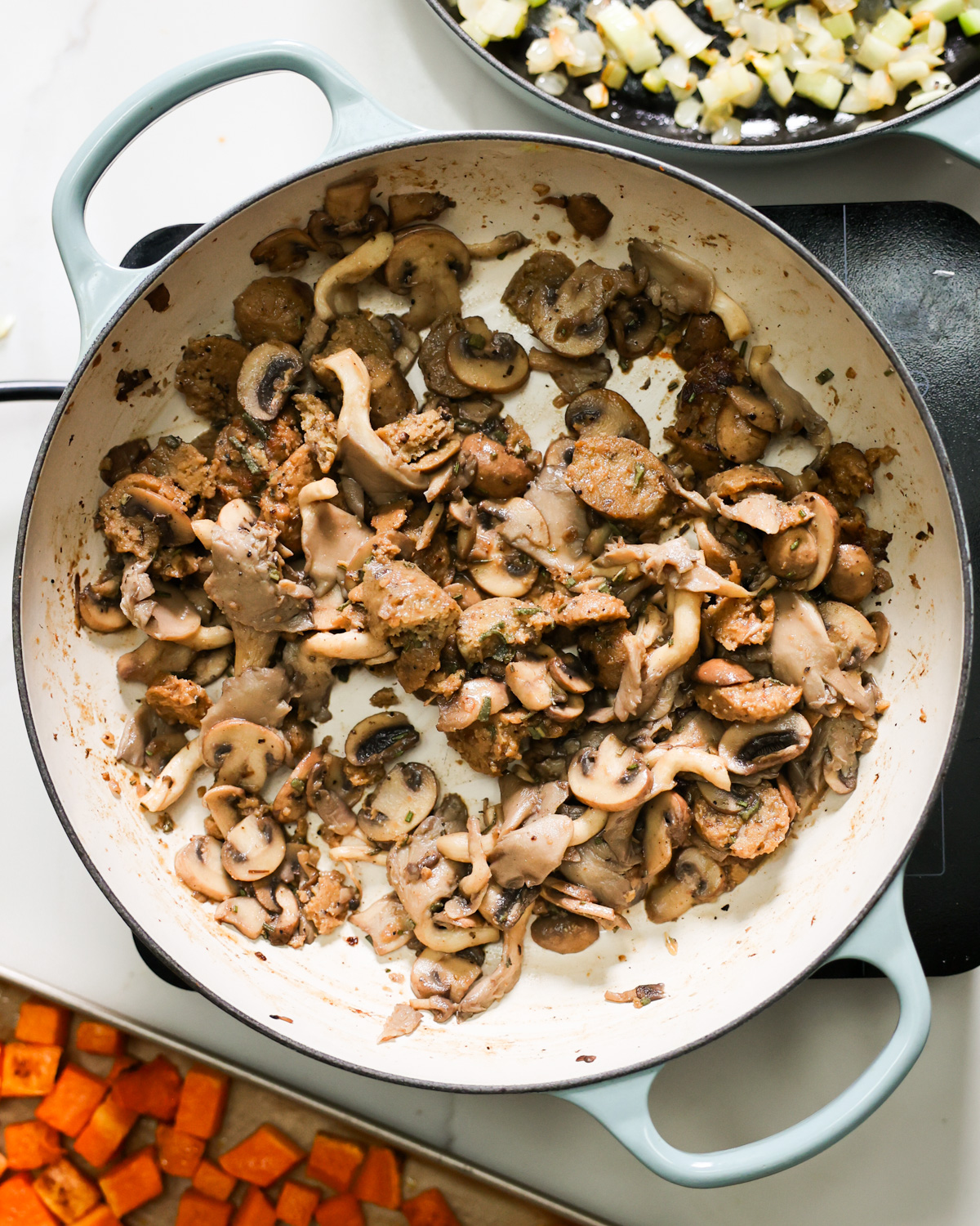 overhead mushrooms and sausage cooking